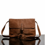 Messenger bag with front buckle and cross body strap in Brown