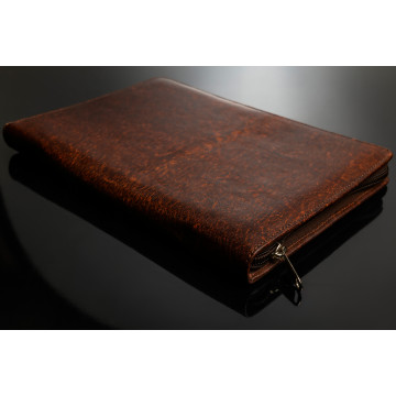 A4 PLUS document holder in a mottled safari gameskin. Suede interior with inside pocket to hold documents